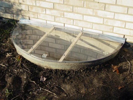 sloped semi circular clear top basement well cover